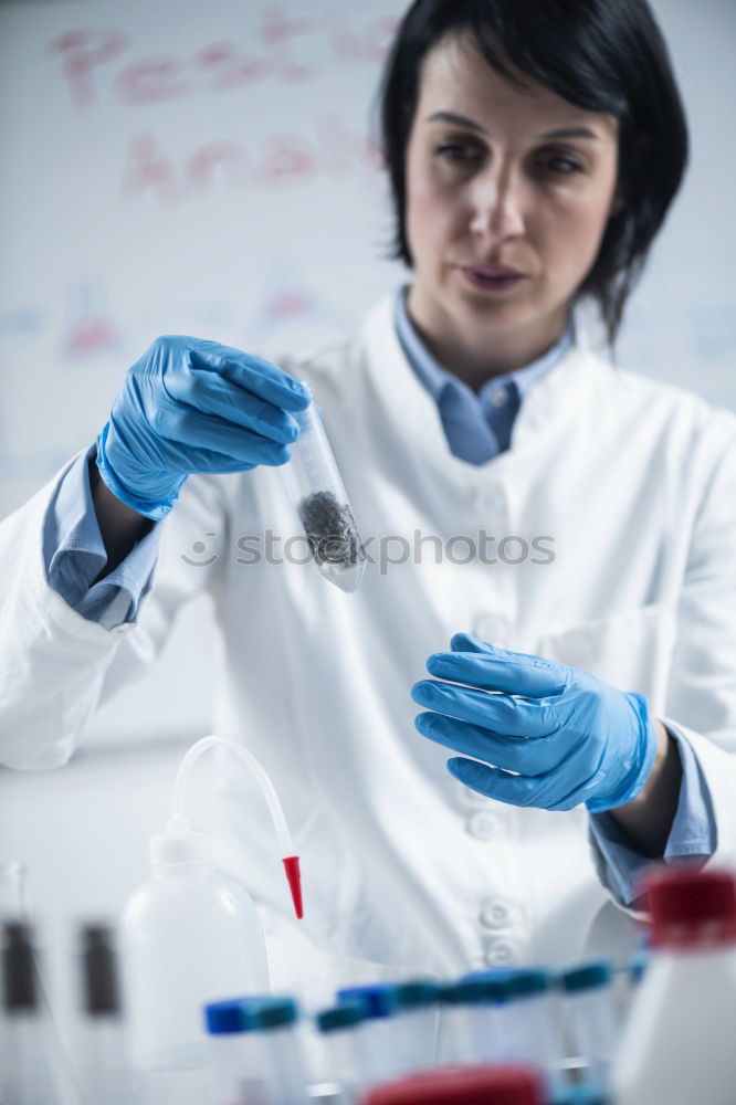 Similar – Image, Stock Photo Worker putting liquid to test tube