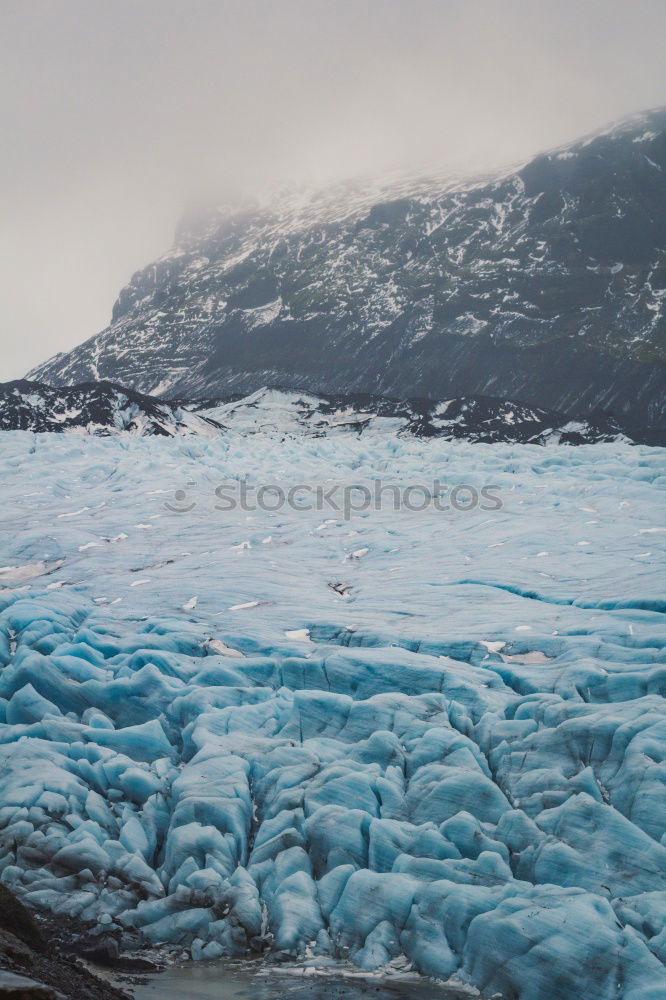 Similar – Icy frost terrain with rocky mountains