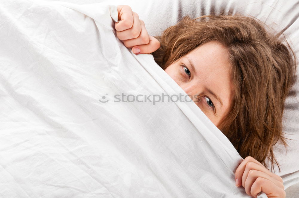 Similar – Portrait of an attractive, young, sexy dark haired woman in Bed, hand and head on the pillow under the blanket, Copy space.