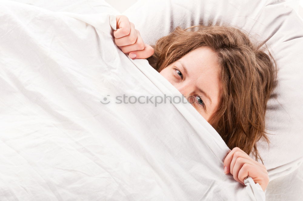 Similar – Portrait of an attractive, young, sexy dark haired woman in Bed, hand and head on the pillow under the blanket, Copy space.