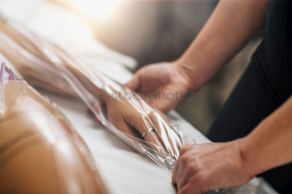 Similar – Back massage with oil and hot stones