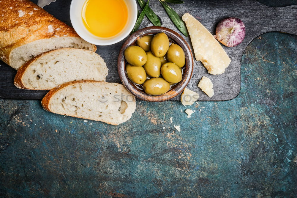 Similar – Image, Stock Photo Baguette with olives, garlic and cheese