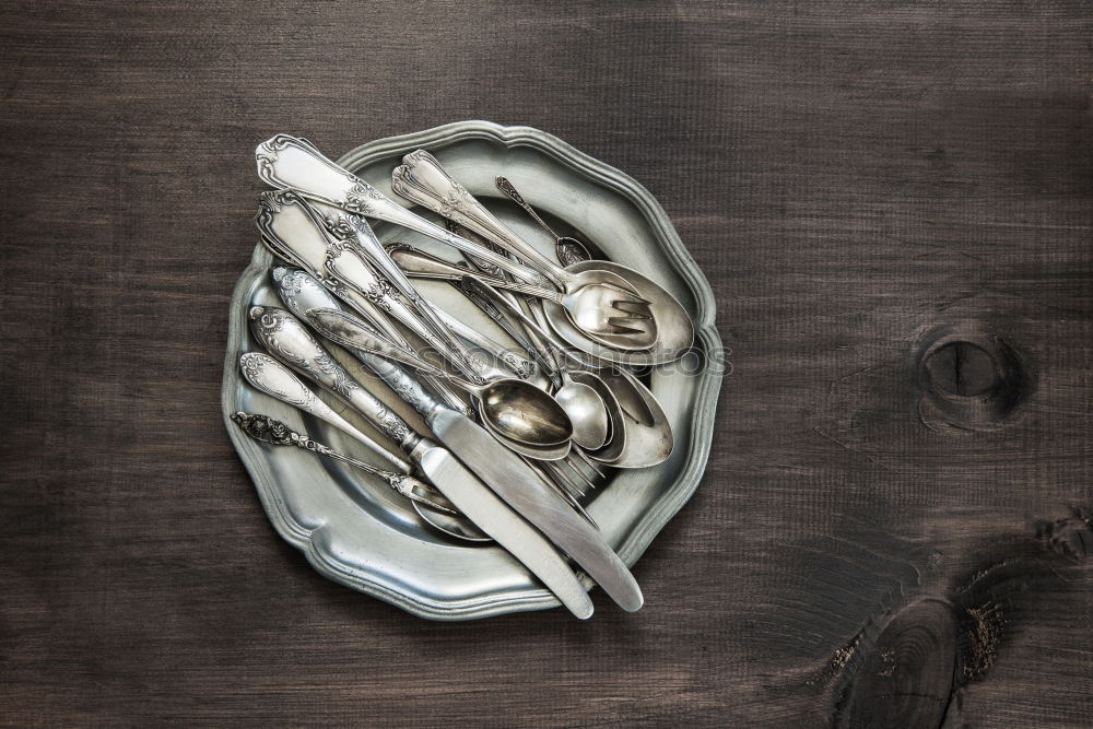 Similar – Brown wooden background with black frying pan