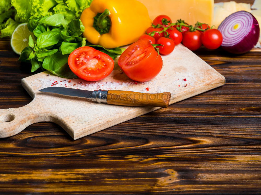 Similar – Vegetables and utensils on kitchen table