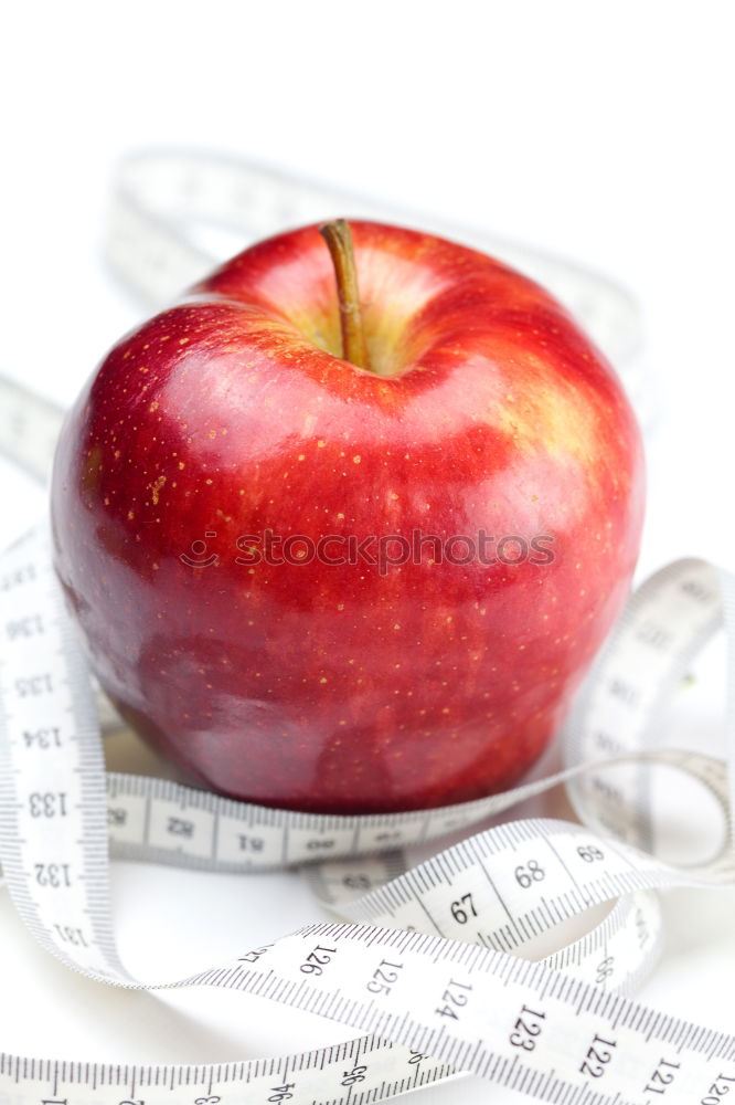 Similar – Red apple with a tape measure