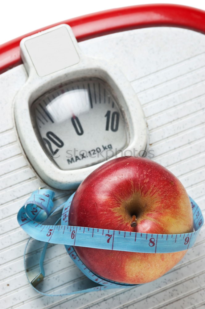 Similar – Red apple with a tape measure