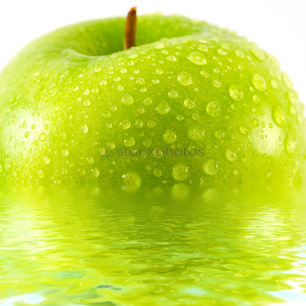 Similar – Apple slice on a green area