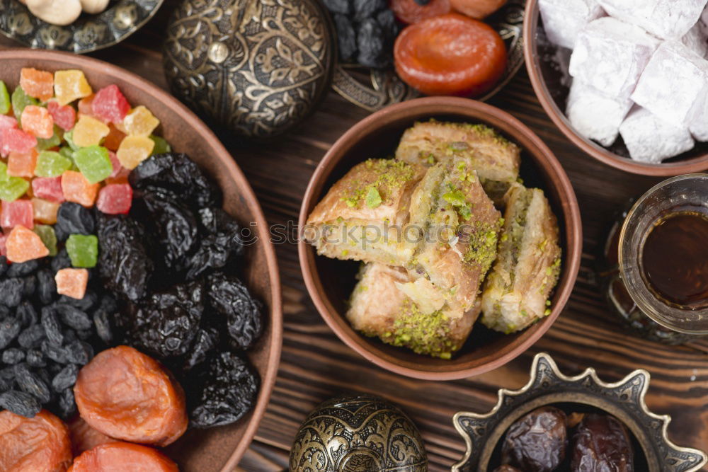 Similar – Image, Stock Photo Dried fruits and nuts in handmade pottery bowls