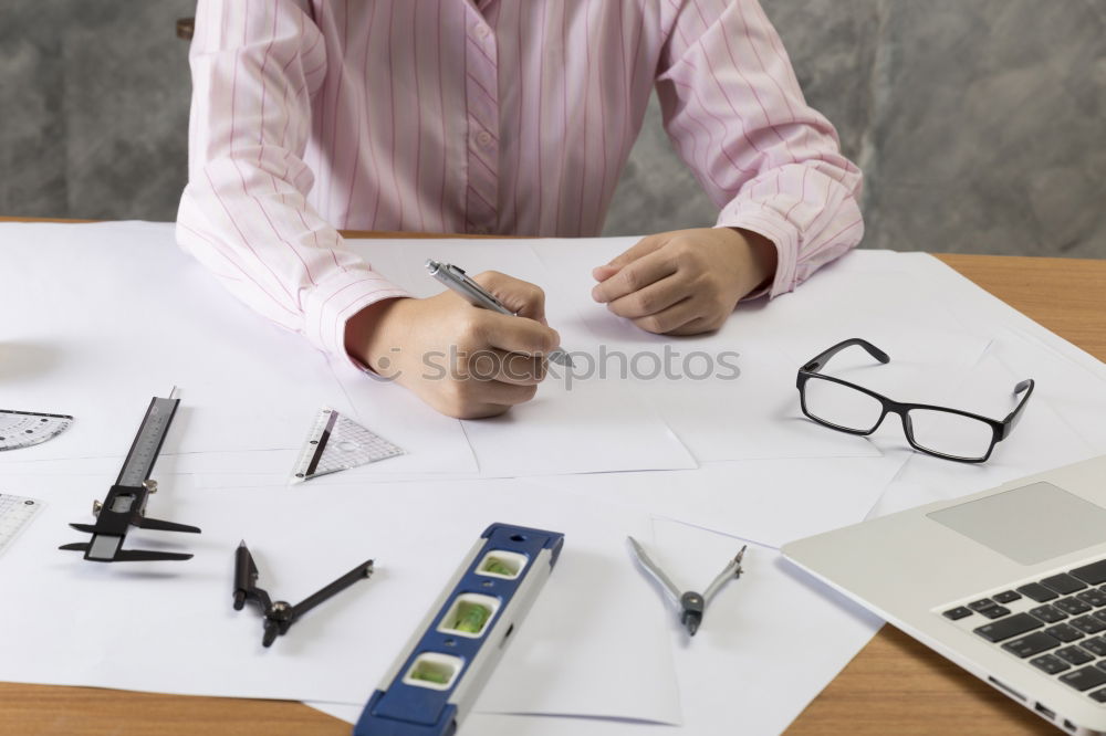 Similar – Image, Stock Photo Young architect working at home drawing plans