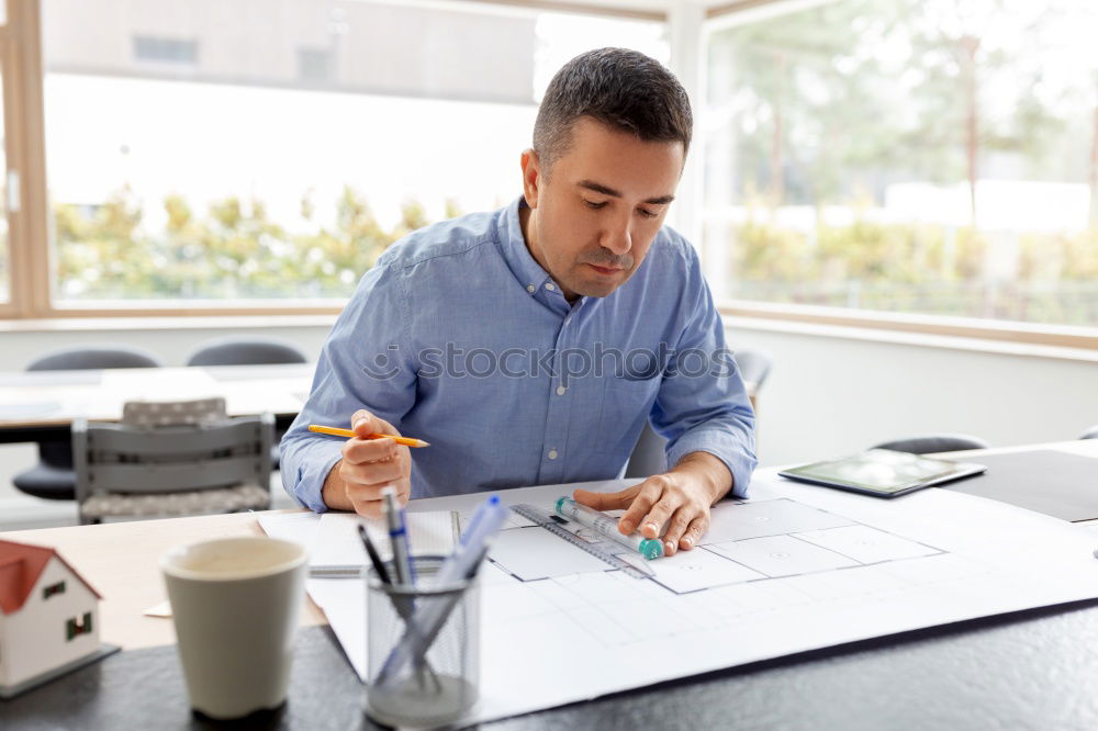 Similar – Image, Stock Photo Architect or planner working on drawings for construction