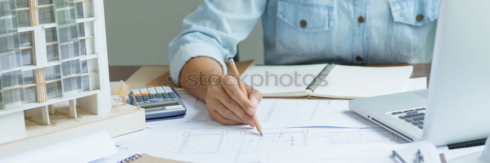 Image, Stock Photo Young architect working at home drawing plans