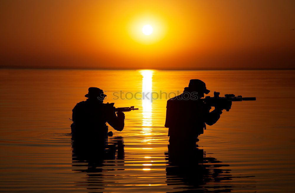 Similar – Men in the sunset Man