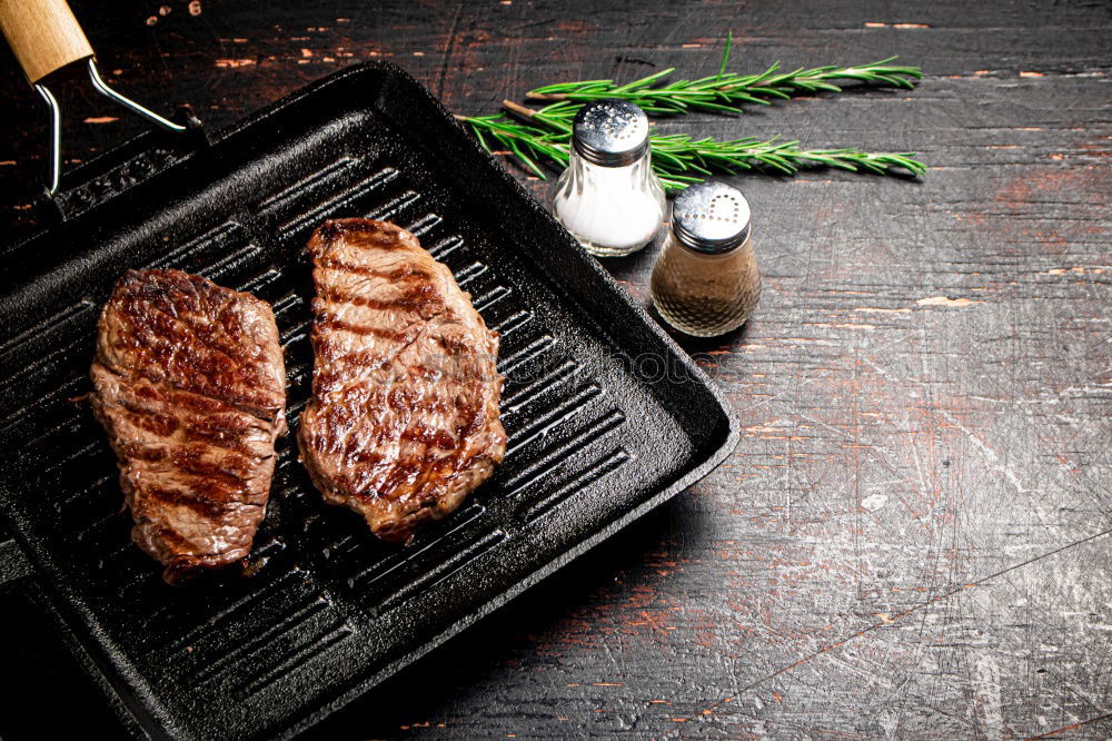 Similar – Image, Stock Photo Ribeye steak on grill iron pan