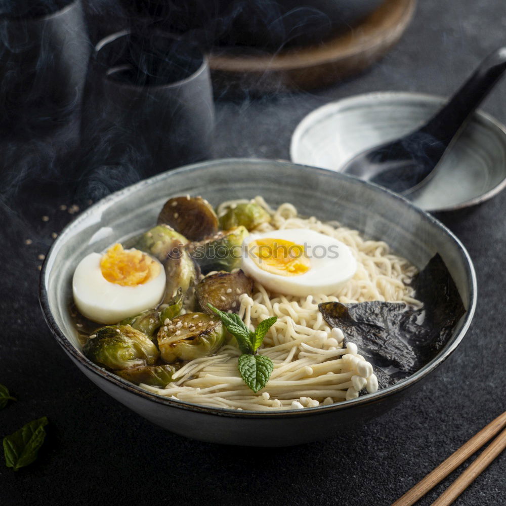 Similar – Geometric bowl of Asian Noodle Soup with chopsticks