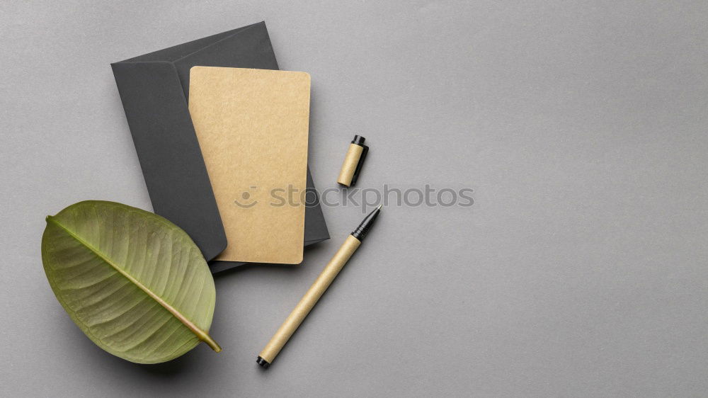 Similar – Green office: notepad with pencil, eraser, sharpener, hole punch and a cup of coffee