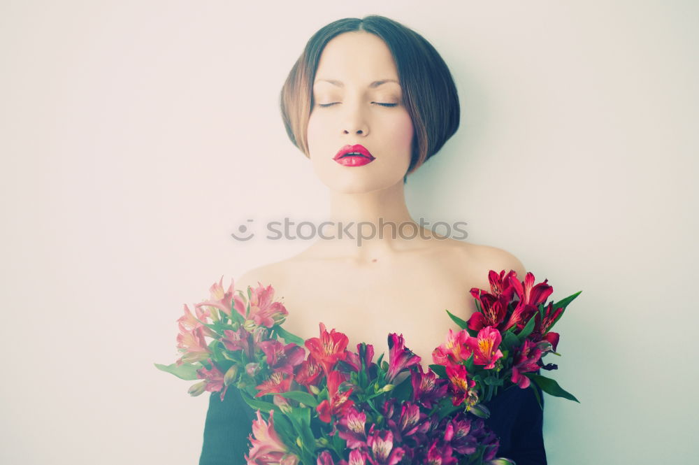 Similar – Young woman hugging a bouquet of flowers