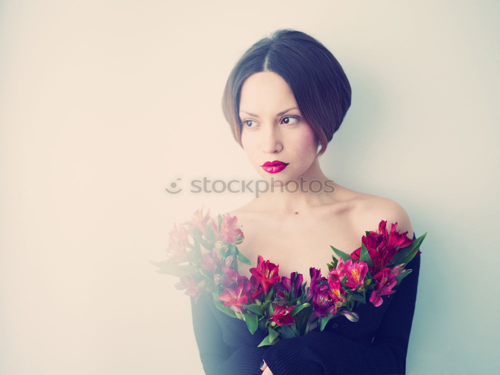 Similar – Young woman hugging a bouquet of flowers