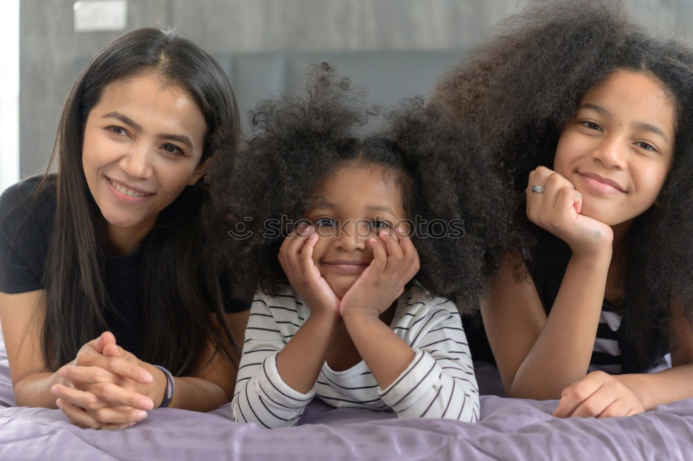 Similar – Image, Stock Photo African american mother giving daughter a kiss on cheek