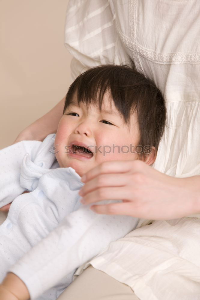 Similar – sad son hugging his mother at home. Concept of couple family is in sorrow.