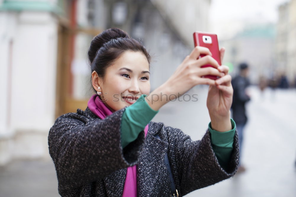 Similar – Stylish Woman Taking Selfie at the City Street