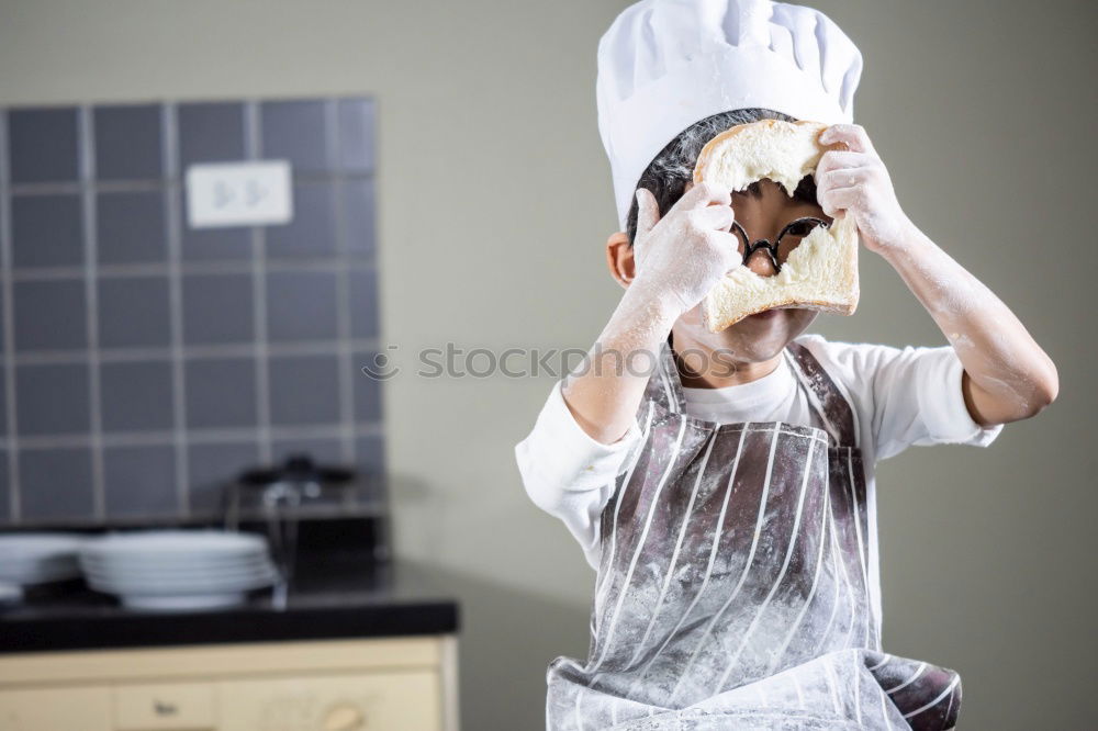 Similar – senior woman with cook hat and rolling pin and spatula on gray background