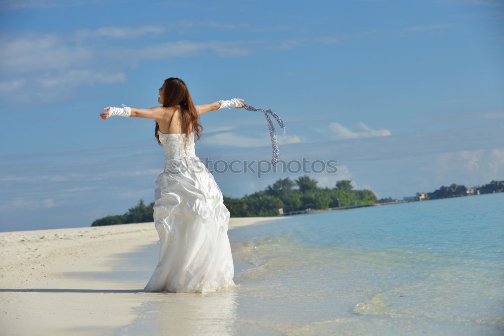 Similar – Image, Stock Photo Bride on the beach Wedding