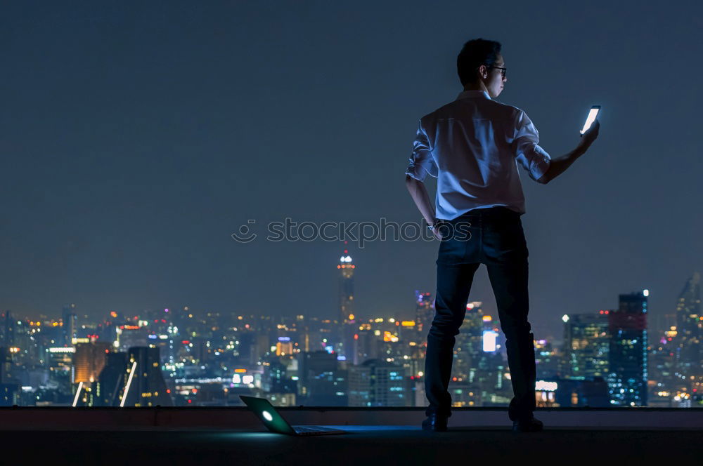 Similar – Image, Stock Photo Young people using tablet computer at home. They looking at pictures standing by the window in the evening. City lights outdoor