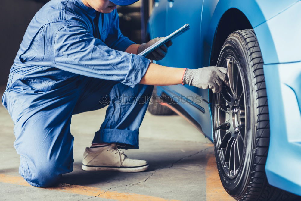 Similar – Image, Stock Photo Professional Mechanic Repairing Car Engine.