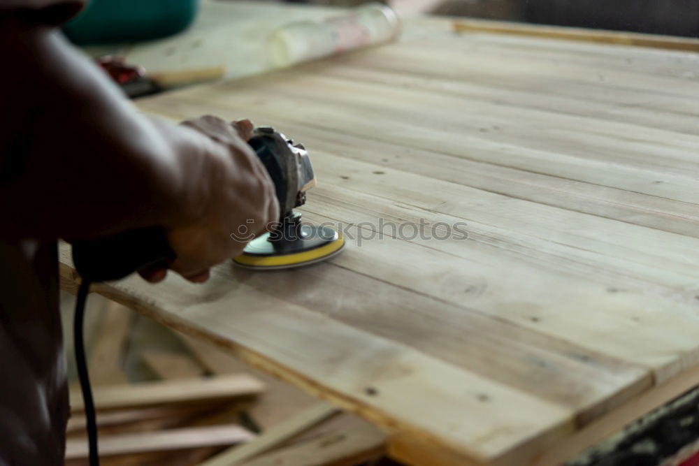 Carpenter tools on wooden table with sawdust. Circular Saw.