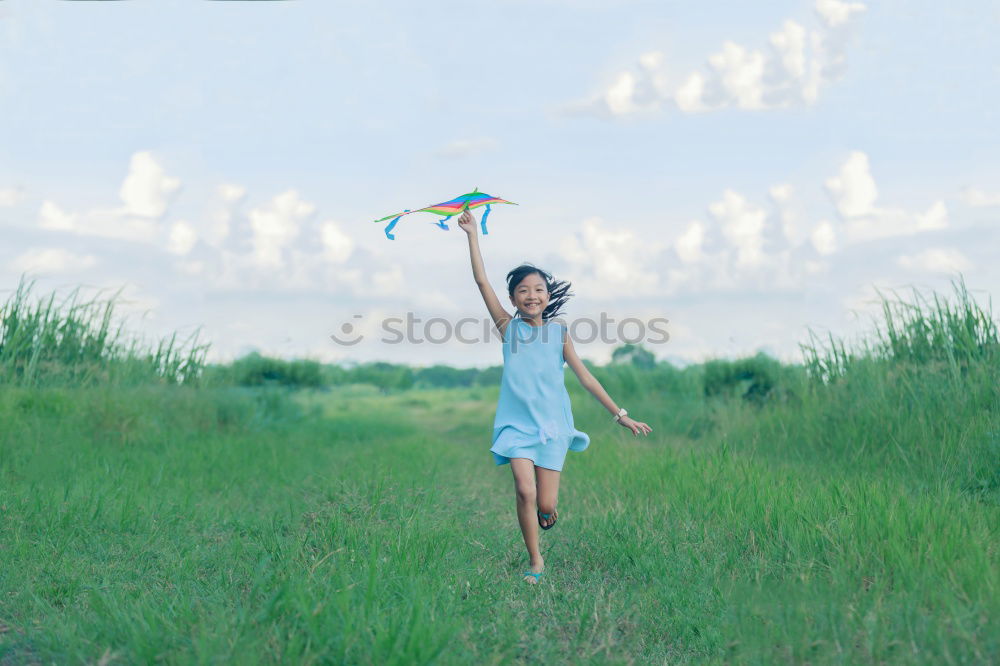 Similar – Woman throwing up hat in nature