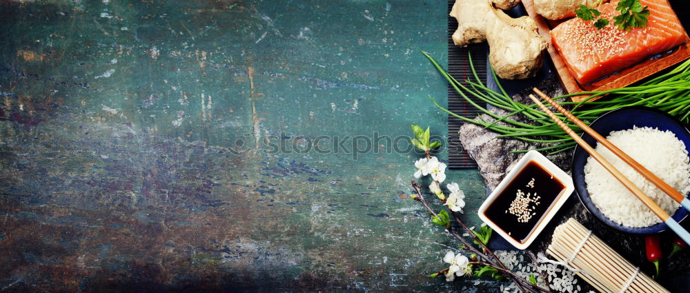 Fish and red chillies dry on a blue table