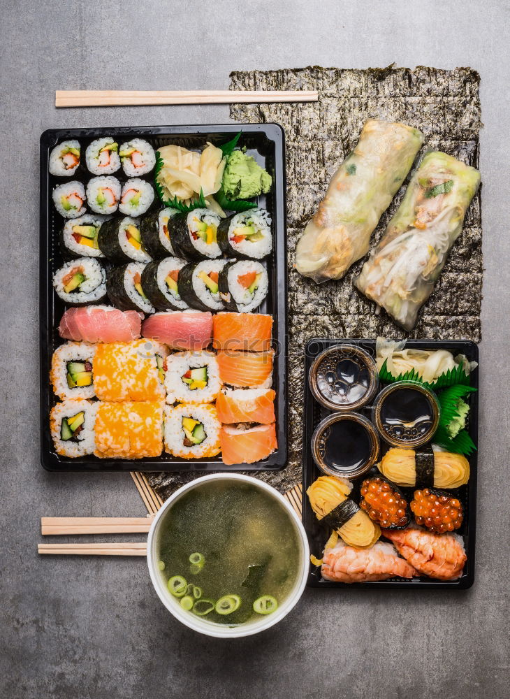 Asian menu with sushi, rice paper summer rolls and miso soup