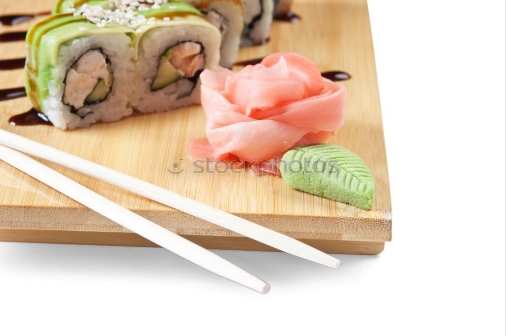 Similar – Closeup of woman chef cutting japanese sushi roll