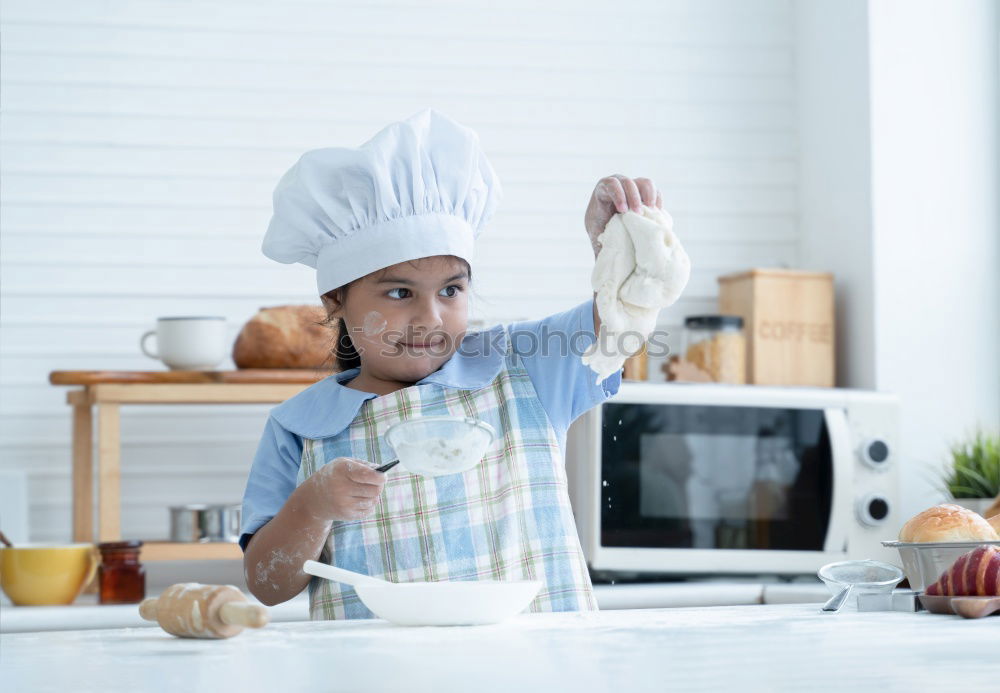 Similar – little african girl making cupcakes in kitchen