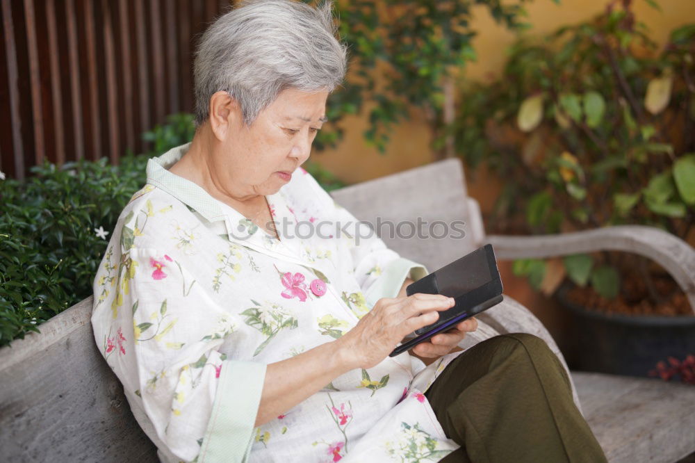 Similar – Senior citizen with smartphone