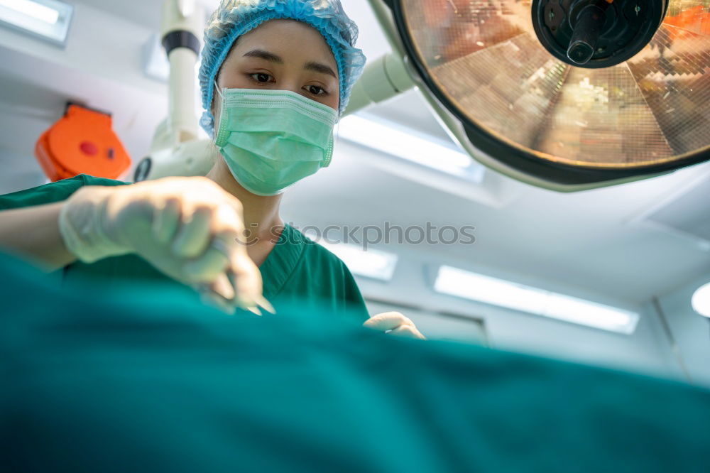 Similar – Image, Stock Photo Team of Surgeons Operating.