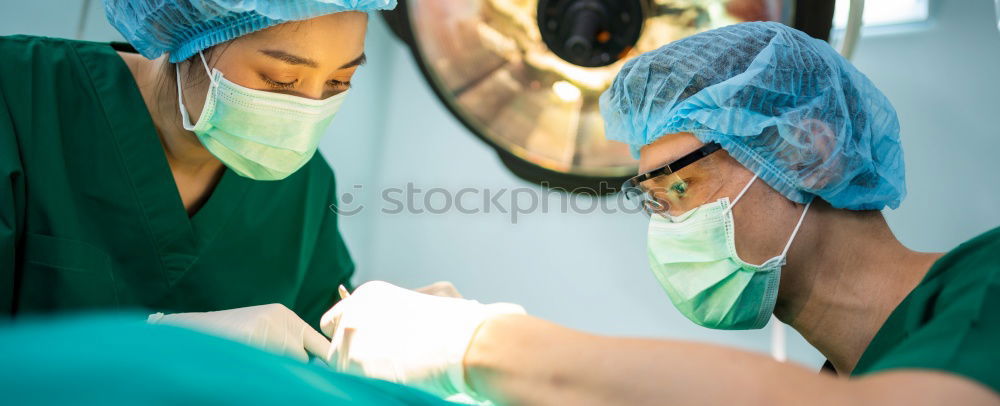 Similar – Image, Stock Photo Team of Surgeons Operating.