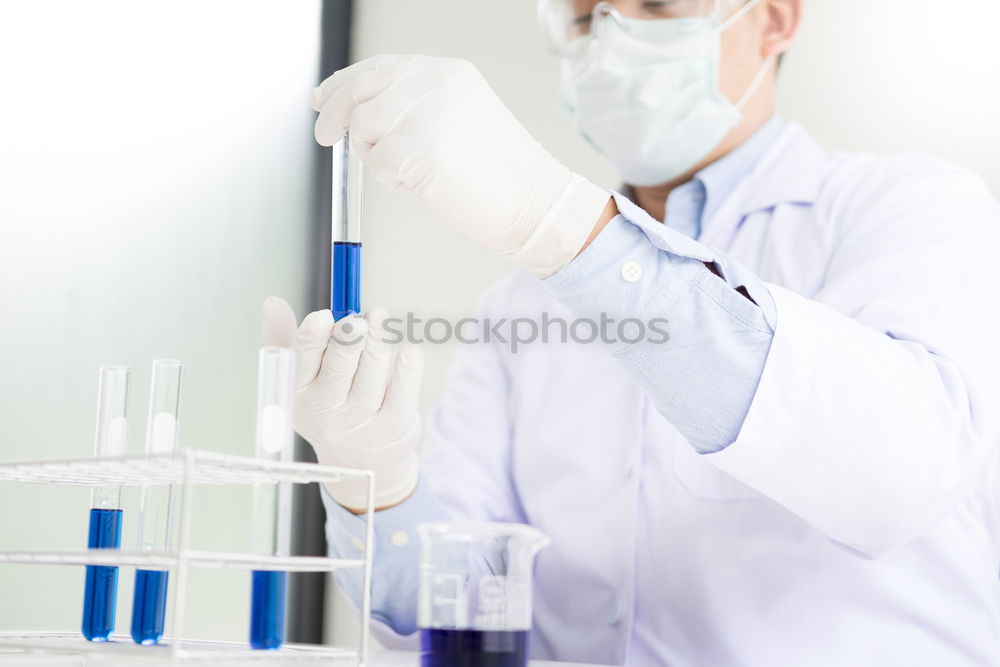 Similar – Image, Stock Photo Worker putting liquid to test tube