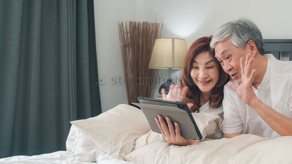 Similar – Image, Stock Photo Young couple reading book on couch at home