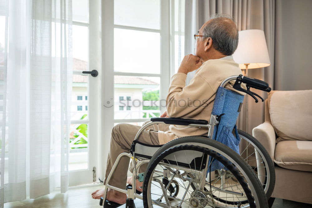 Similar – Senior woman sitting in wheelchair in hospital