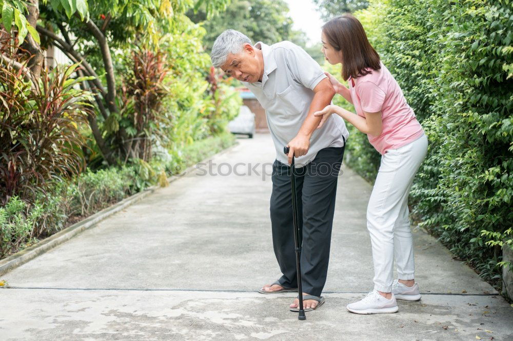 Image, Stock Photo Cheerful young man teaching his son to play mini golf