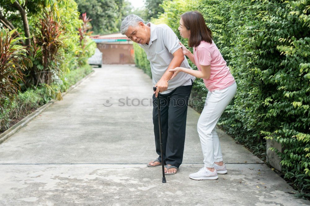 Similar – Image, Stock Photo Cheerful young man teaching his son to play mini golf