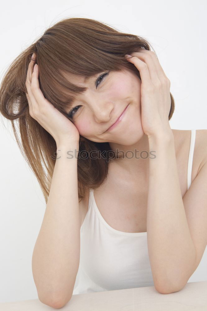 Similar – Portrait of a cute little girl with colored bracelets lying on her arm