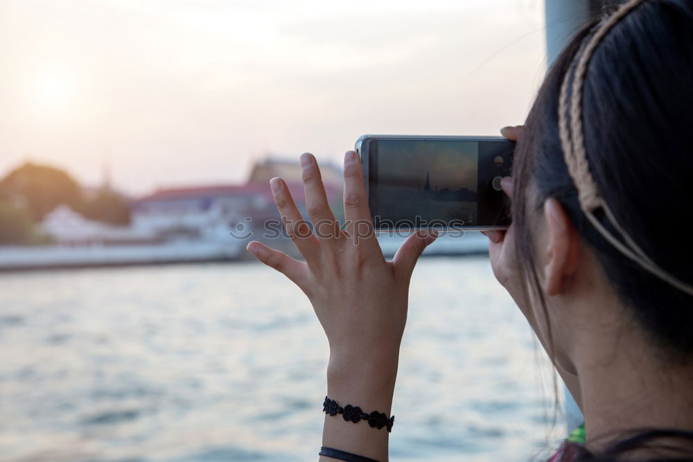 Similar – Image, Stock Photo two friends in the street taking pictures with mobile phone