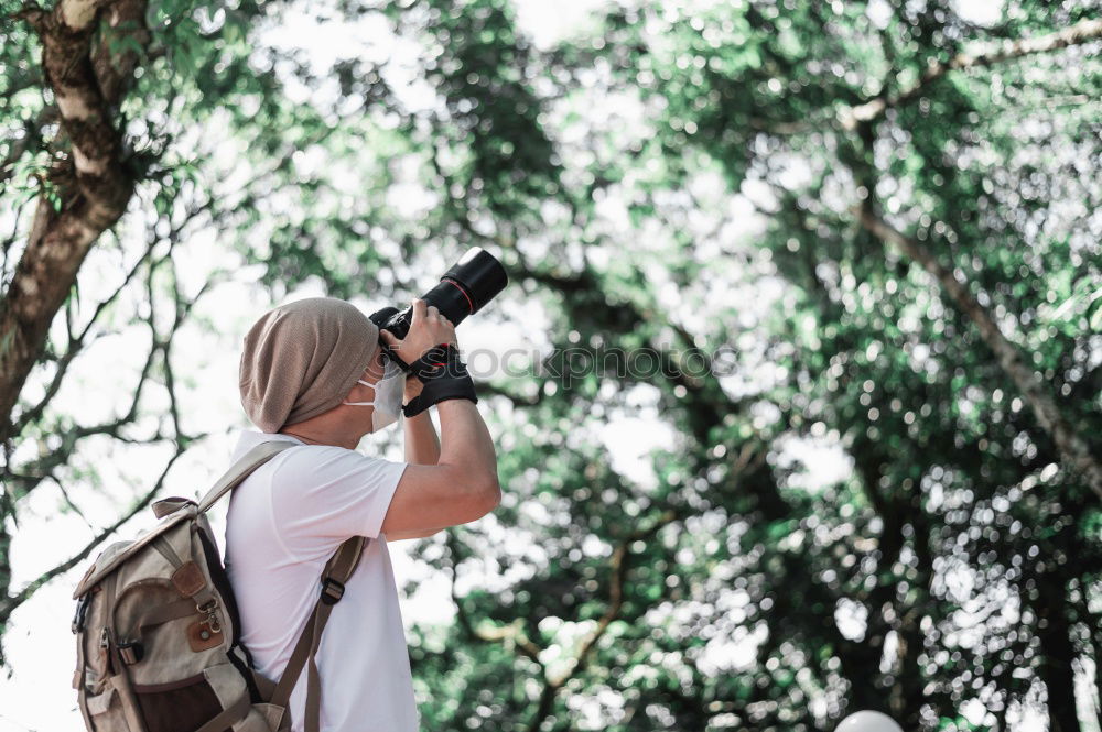 Image, Stock Photo Woman taking shots in forest