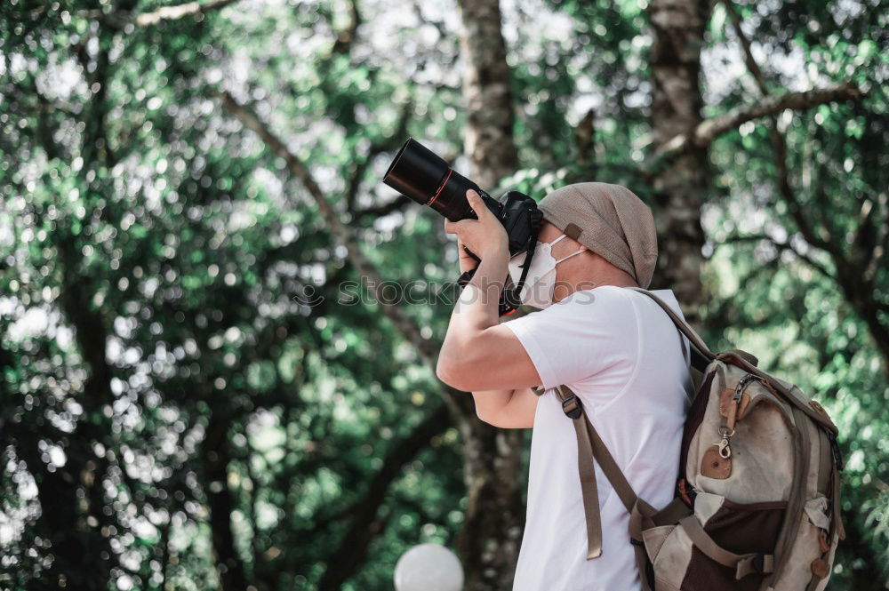 Similar – Image, Stock Photo Couple doing trekking looking with binoculars