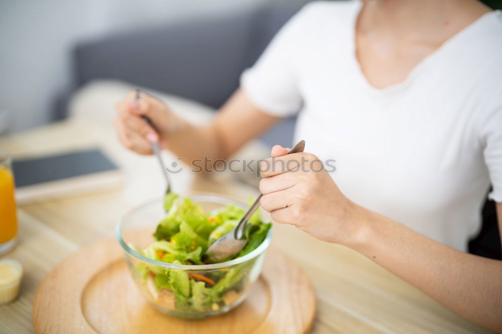 Similar – Image, Stock Photo Woman eating quinoa and vegetables in bowl