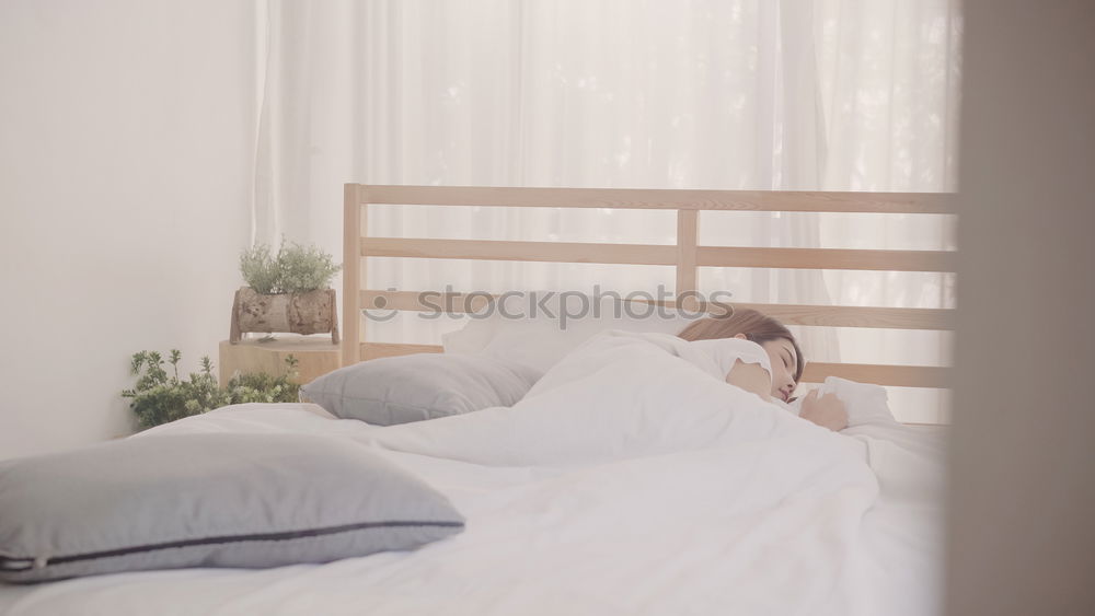 Similar – happy kid girl waking up in early morning in her room, lying in bed