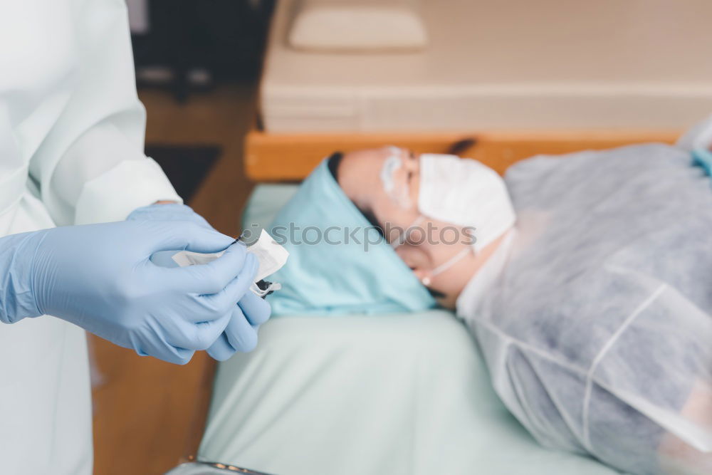 Similar – Image, Stock Photo A fragment of a dental room with a kid, lying on a dental chair, and a part of his doctors figure