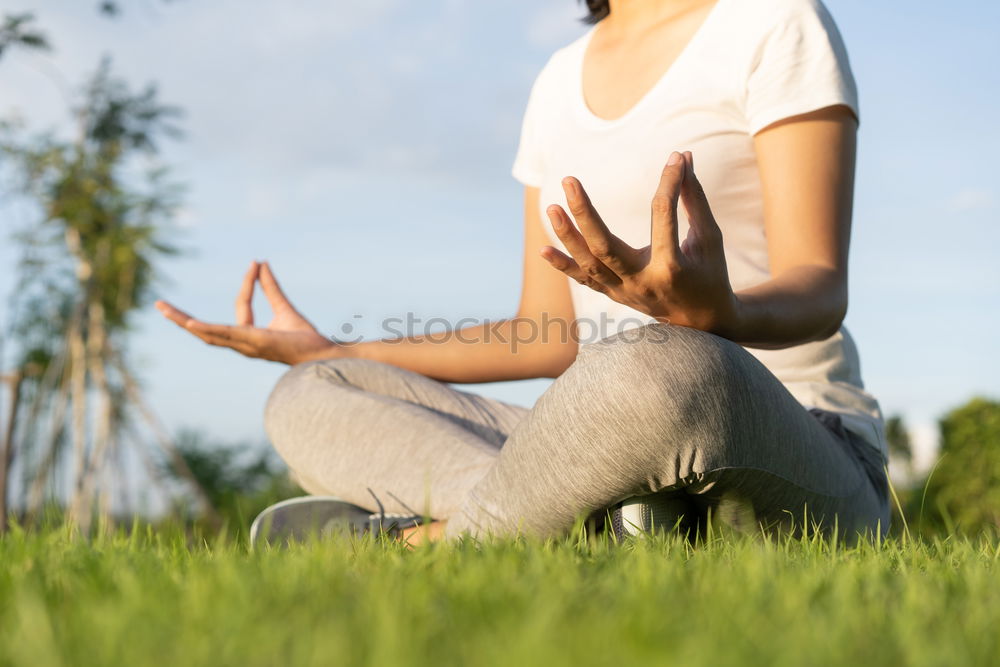 Similar – Image, Stock Photo Young woman doing yoga in nature.